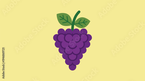 Bunch of fresh purple grapes with green leaves on yellow background.