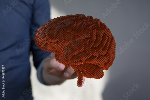 A person holds a detailed 3...