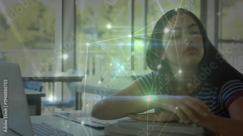 Animation of network of connections over schoolgirl sleeping on desk