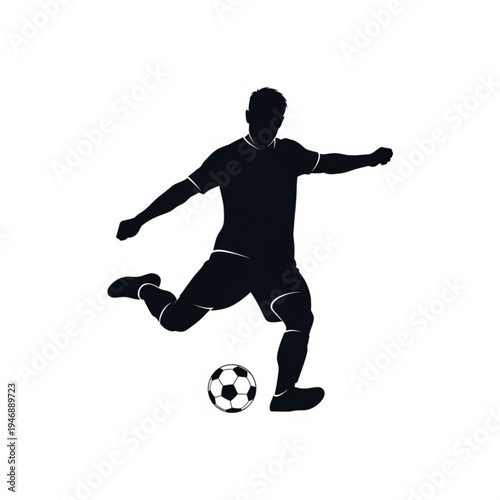 Silhouette of a soccer player kicking a ball