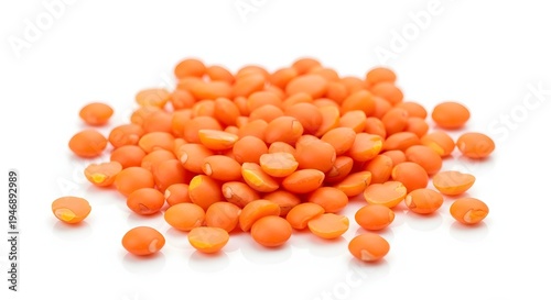Pile of red lentils, small nutritious legumes, healthy vegetarian food ingredient, used in cooking for soups, stews, and salads