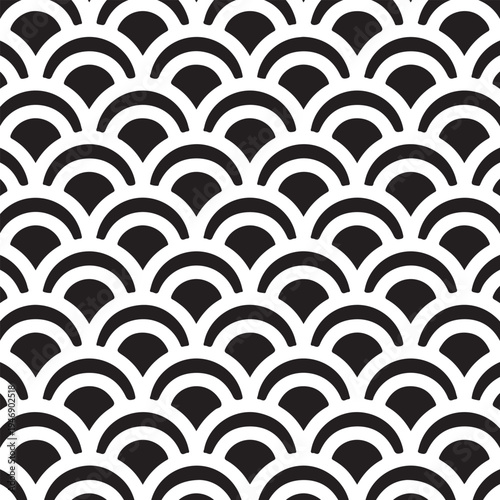 Classic black seigaiha waves create a timeless scalloped pattern.