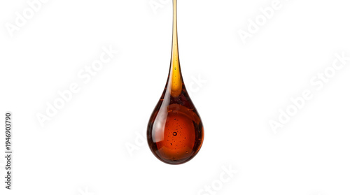 Precious nectar's suspended descent, a rich amber tear gleaming vibrantly against pure white
