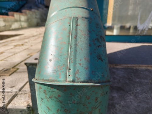 Wallpaper Mural Close view of weathered green metal rainwater downspout connection attached to building exterior wall showing drainage construction detail Torontodigital.ca