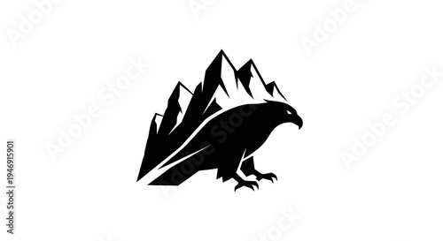 Eagle perched on mountain range silhouette