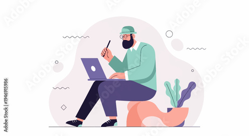 Bearded man wearing glasses and a hat works on a laptop, seated on a unique stool