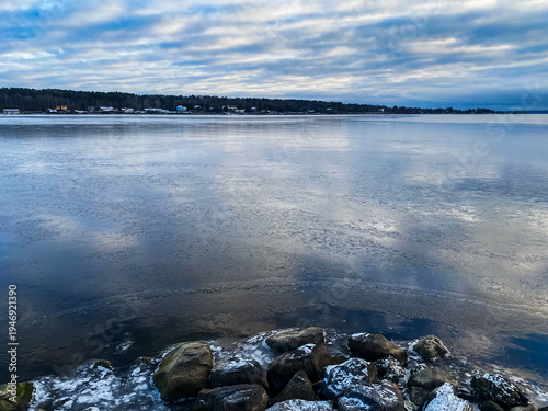 Winter landscape. The shore of Lake Onega covered with the first ice. Karelia.