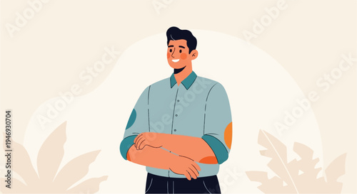 A person in a blue collared shirt with arms crossed, standing against a neutral background