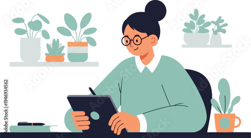 A person wearing glasses and a sweater is drawing on a tablet at a desk