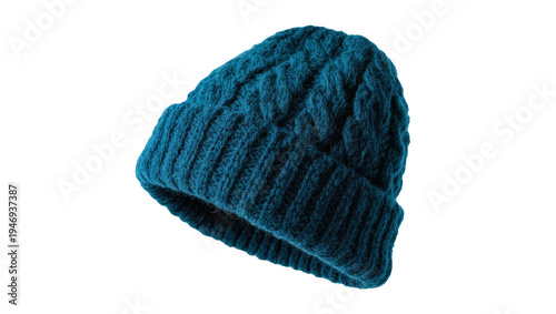 Isolated knitted teal beanie hat with cable knit pattern and ribbed cuff for winter fashion