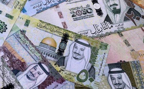 Photos Saudi riyal money bills pile on table