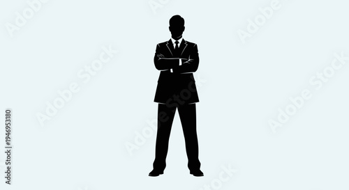Silhouette of a businessman in a suit standing with arms crossed against a light blue background