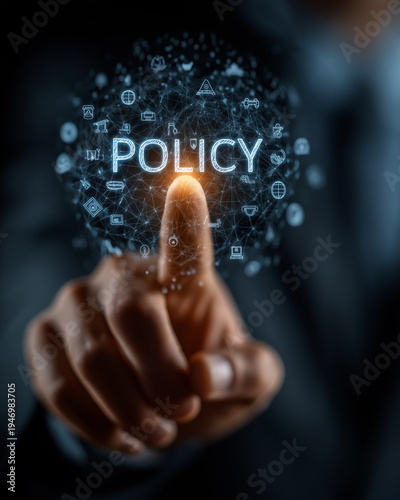 Policy and Precision: A person's index finger makes contact with a glowing POLICY digital interface, suggesting the importance of directives and decision-making.