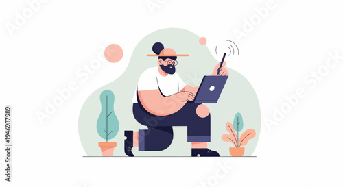 A man with a beard and glasses works on a laptop, holding a stylus