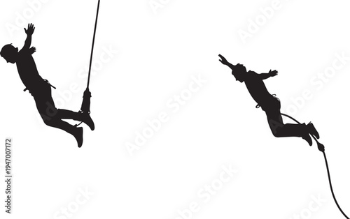 Silhouetted figures mid air seemingly jumping or falling with ropes attached