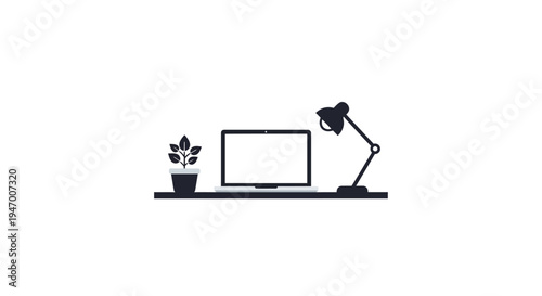 Desk lamp on a desk with computer.