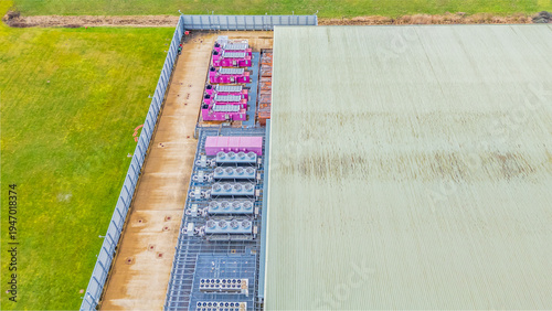 Straight on aerial shot of cooling and backup systems outside of a data centre in Corby, Northamptonshire, UK