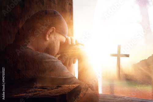 Bilde på lerret Young man praying from window. religion concept.