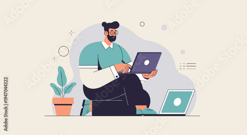 Bearded man in glasses typing on laptop, plant and laptop nearby