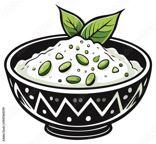 Bowl of dip with pistachios and mint leaves.