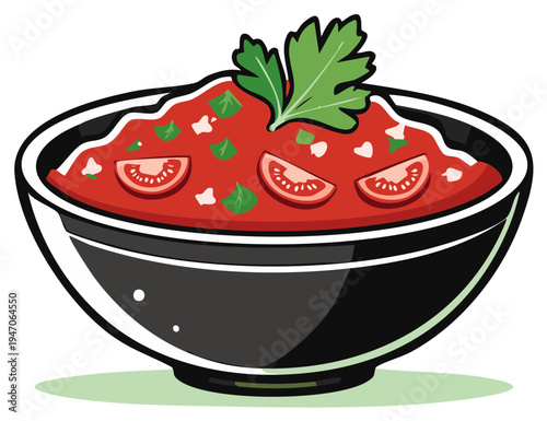 Fresh tomato soup with parsley garnish served in a black bowl ready to eat.