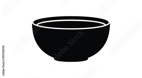 A simple black bowl is prominently displayed against a white background showcasing its curved form a silhouette