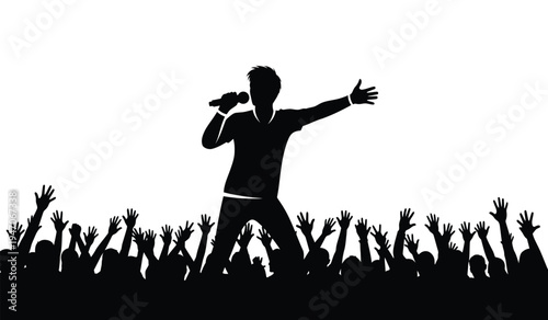 A silhouette of a male singer performing with a microphone in front of a cheering concert crowd