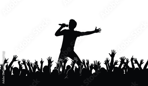 A black silhouette of a singer performing on a stage in front of a cheering crowd of music fans