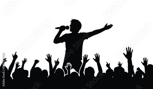A silhouette of a male singer performing on stage in front of a cheering crowd with raised hands