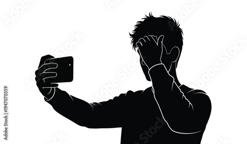 A silhouette of a young man holding a smartphone up to take a selfie while touching his forehead