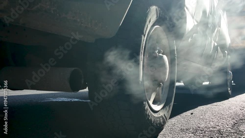 closer shot of smoking truck tailpipe