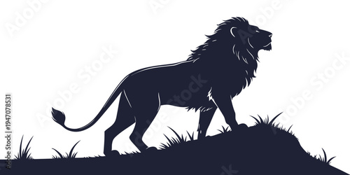 Majestic lion standing on a hill with a full mane and tail flowing in the wind