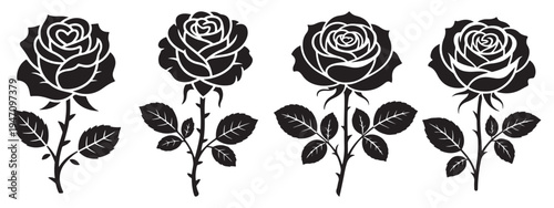 A collection of four black rose blooms with stems and leaves presented as a silhouette