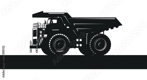 A large black mining dump truck is prominently displayed against a stark white background a striking silhouette