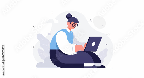 Person with bun hairstyle and glasses works on a laptop