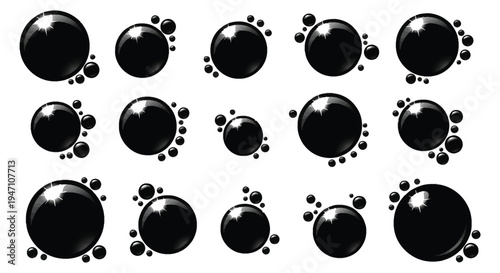 A collection of glossy black spheres with white highlights arranged on a white background