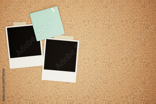 Blank Polaroid Frames and Mint Green Sticky Note Pinned on Cork Board