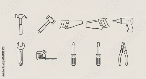 Collection of essential hand tools and power tools for diy projects and construction work on a neutral background