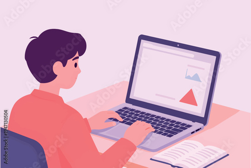 A young man diligently working on a laptop with a book nearby