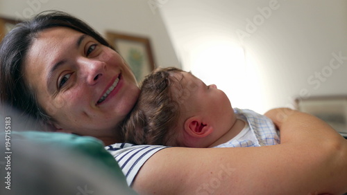 Canvas Print Mother smiling while holding baby, affectionate moment, joy, warmth, security, t