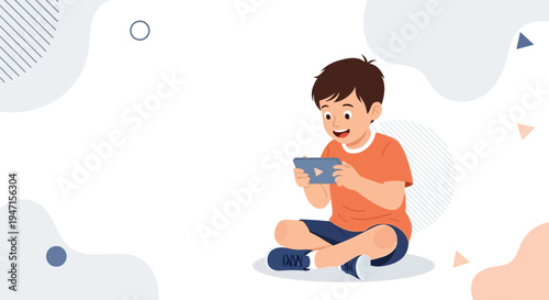 Happy boy playing video games on a tablet, sitting cross-legged on the floor