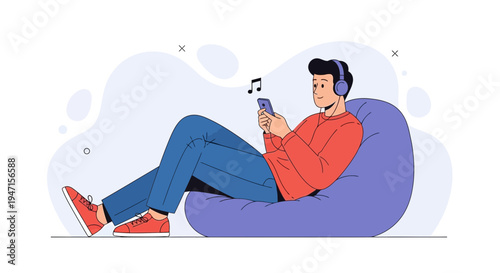 Man Listening Music on Phone While Relaxing on Bean Bag Chair