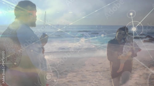 Network graphic appearing, parents holding rod and cradling baby, connecting family via tech