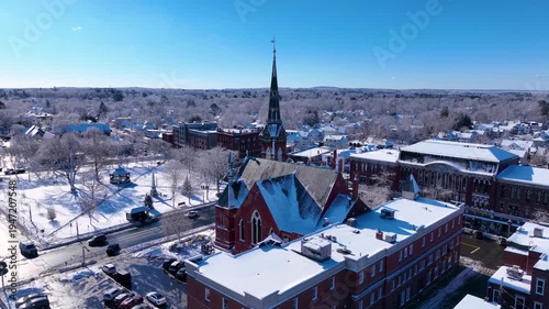 First Congregational Church aerial view in winter with snow at 2 E Central Street in historic town center of Natick, Massachusetts, USA.