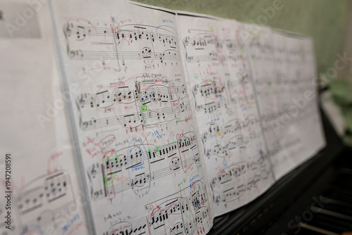Fotografie piano classical music sheet with written notations all over on a piano