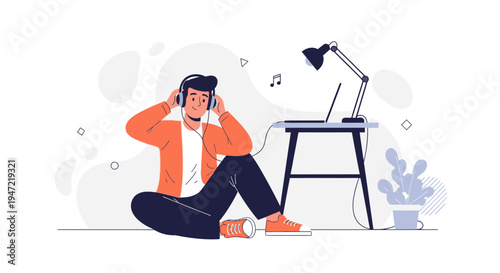 Young man listening to music with headphones, working on laptop