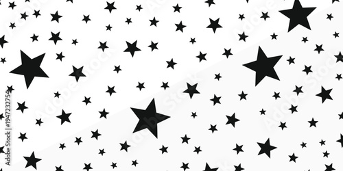 A starry night sky pattern with various sized black stars on a white background creating a beautiful celestial design