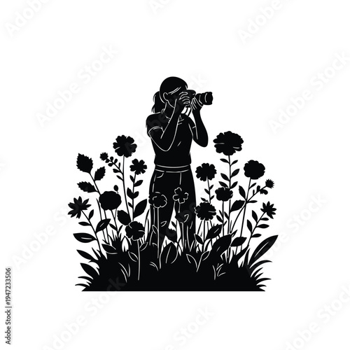 Woman photographer silhouette capturing flowers in blossom garden area