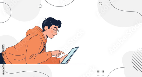 Young man in orange hoodie using tablet, lying down, modern design background