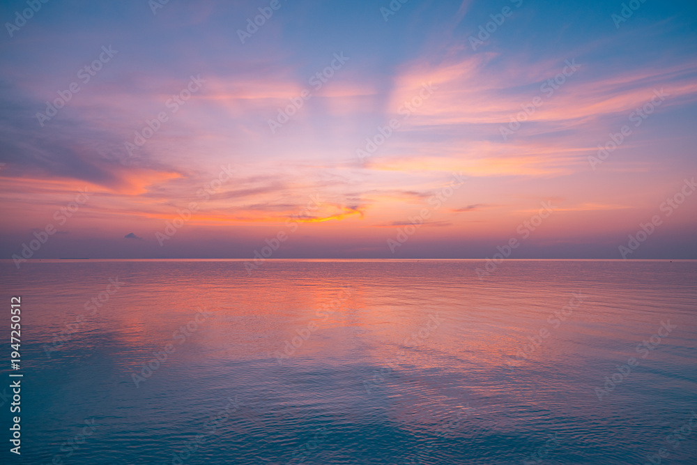 Fototapeta premium Idyllic ocean sunset with vibrant golden sky and tranquil turquoise water, serene tropical beach scenery, peaceful summer vacation destination